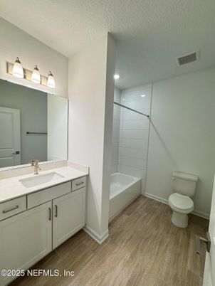 Bathroom, Dual Sink Vanities, Glass Shower, Interior, Recessed Lighting, Wood Texture Flooring