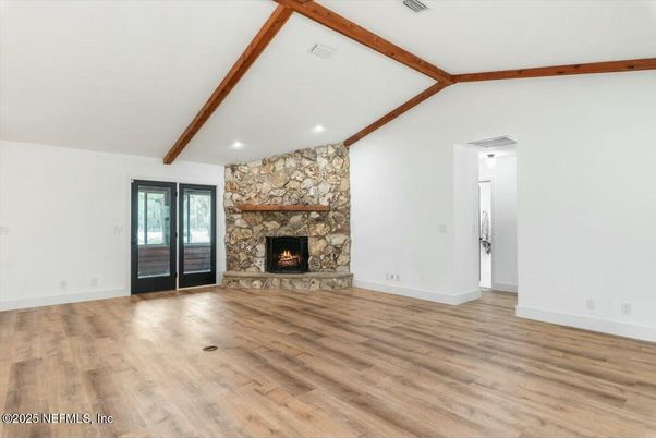 Empty room, Fireplace, Interior, Recessed Lighting, Stone Walls, Wooden Beams, Wood Texture Flooring
