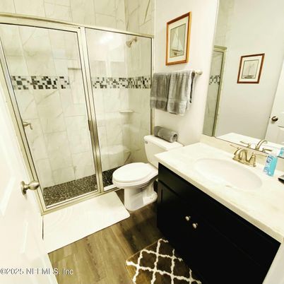 Bathroom, Glass Shower, Interior, Marble Walls, Wood Texture Flooring