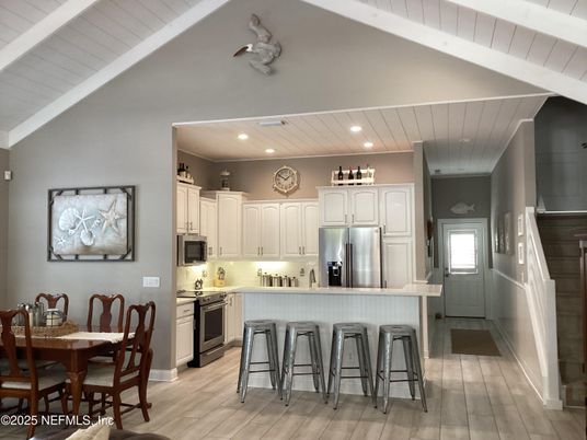 Dining room, Interior, Kitchen, Recessed Lighting, Stainless Steel Appliances, Wood Texture Flooring