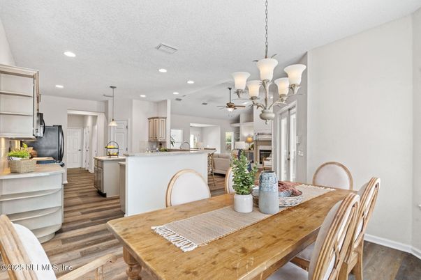 Dining room, Interior, Kitchen, Pendant Lights, Recessed Lighting, Stainless Steel Appliances, Wood Texture Flooring