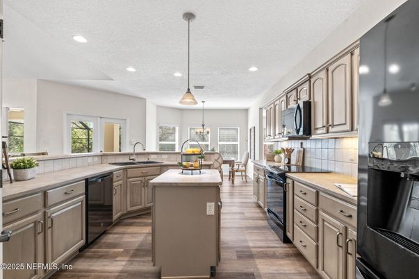Dining room, Interior, Kitchen, Pendant Lights, Recessed Lighting, Stainless Steel Appliances, Wood Texture Flooring