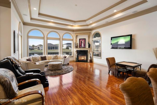 Dining room, Fireplace, Interior, Living room, Recessed Lighting, Wood Texture Flooring