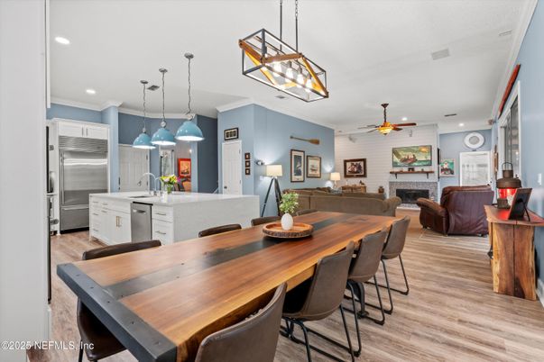 Dining room, Fireplace, Interior, Kitchen, Living room, Pendant Lights, Recessed Lighting, Stainless Steel Appliances, Stone Walls, Wood Texture Flooring