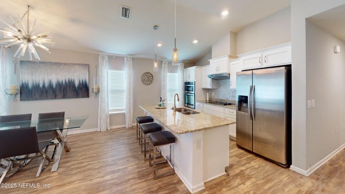 Dining room, Interior, Kitchen, Pendant Lights, Recessed Lighting, Stainless Steel Appliances, Wood Texture Flooring