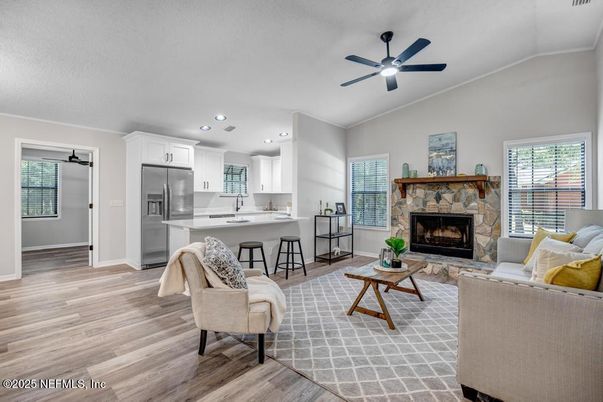 Fireplace, Interior, Kitchen, Living room, Recessed Lighting, Stainless Steel Appliances, Wood Texture Flooring