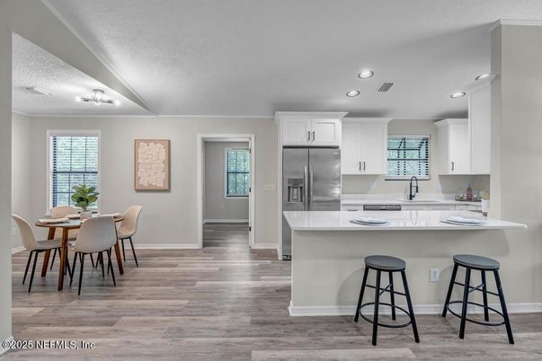 Dining room, Interior, Kitchen, Recessed Lighting, Stainless Steel Appliances, Wood Texture Flooring
