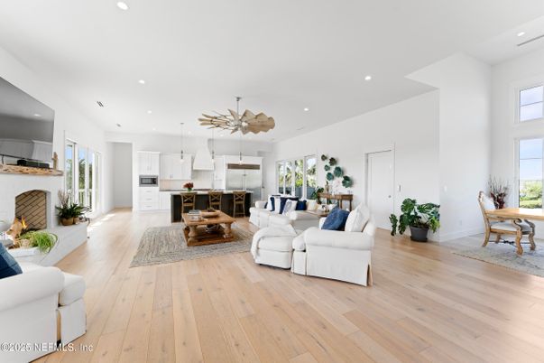 Dining room, Fireplace, Interior, Kitchen, Living room, Pendant Lights, Recessed Lighting, Stainless Steel Appliances, Wood Texture Flooring