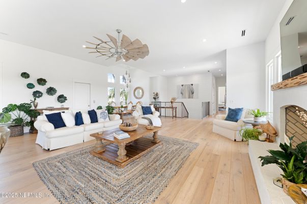 Dining room, Fireplace, Interior, Living room, Recessed Lighting, Wood Texture Flooring