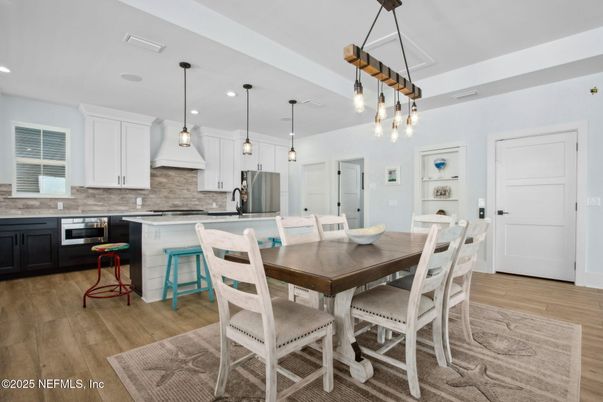 Dining room, Interior, Kitchen, Pendant Lights, Recessed Lighting, Stainless Steel Appliances, Wood Texture Flooring