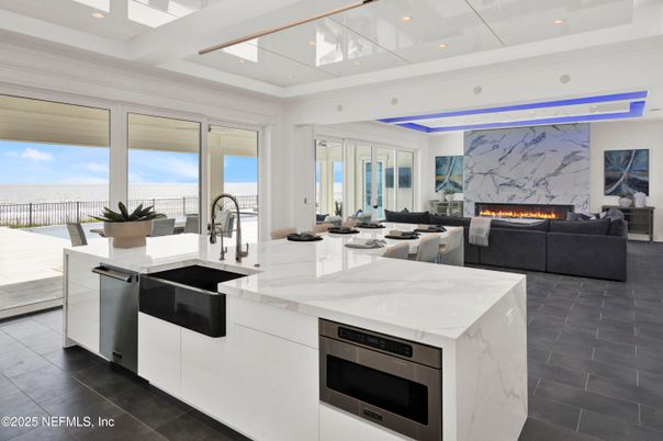 Fireplace, Interior, Kitchen, Living room, Marble Walls, Recessed Lighting, Stainless Steel Appliances