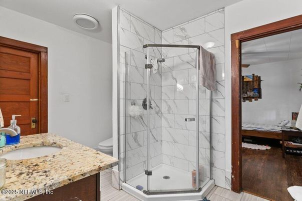 Bathroom, Glass Shower, Interior, Marble Walls, Wood Texture Flooring