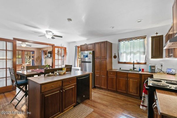 Dining room, Interior, Kitchen, Recessed Lighting, Stainless Steel Appliances, Wood Texture Flooring