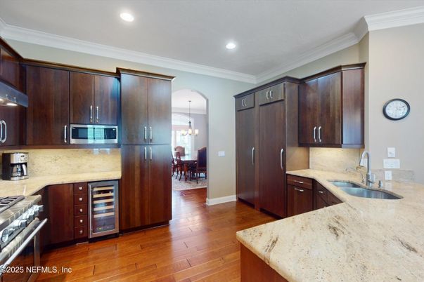 Chandelier, Dining room, Interior, Kitchen, Pendant Lights, Recessed Lighting, Stainless Steel Appliances, Wood Texture Flooring