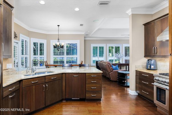 Chandelier, Dining room, Interior, Kitchen, Living room, Recessed Lighting, Stainless Steel Appliances, Wood Texture Flooring