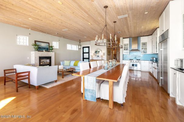 Dining room, Fireplace, Interior, Kitchen, Living room, Pendant Lights, Recessed Lighting, Stainless Steel Appliances, Wooden Ceilings, Wood Texture Flooring