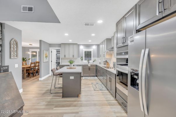 Dining room, Interior, Kitchen, Recessed Lighting, Stainless Steel Appliances, Wood Texture Flooring