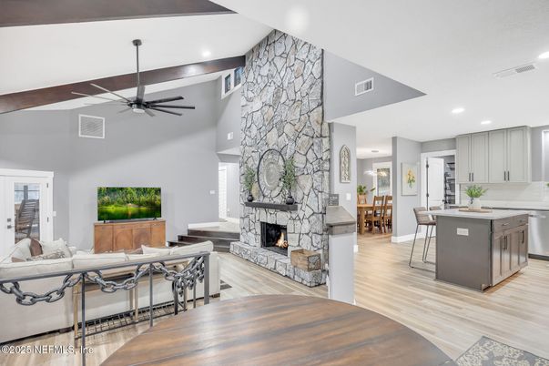 Dining room, Fireplace, Interior, Kitchen, Living room, Recessed Lighting, Stone Walls, Wood Texture Flooring