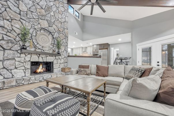 Dining room, Fireplace, Interior, Kitchen, Living room, Recessed Lighting, Stainless Steel Appliances, Stone Walls, Wood Texture Flooring