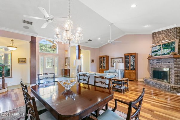 Chandelier, Dining room, Fireplace, Interior, Living room, Recessed Lighting, Stone Walls, Wood Texture Flooring