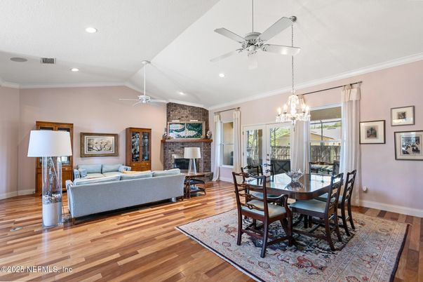 Dining room, Fireplace, Interior, Living room, Recessed Lighting, Stone Walls, Wood Texture Flooring