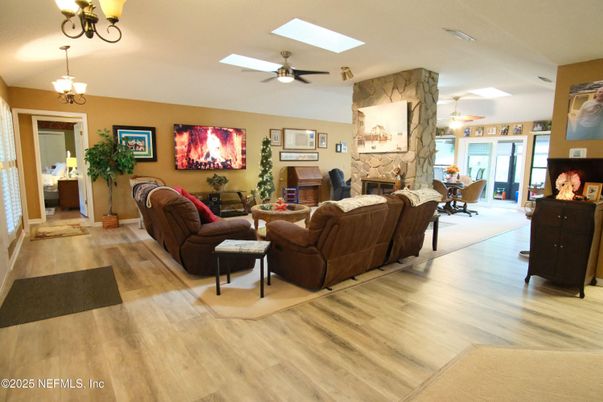 Chandelier, Dining room, Fireplace, Interior, Living room, Wood Texture Flooring