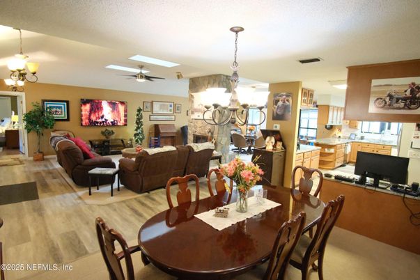 Chandelier, Dining room, Fireplace, Interior, Kitchen, Living room, Pendant Lights, Wood Texture Flooring