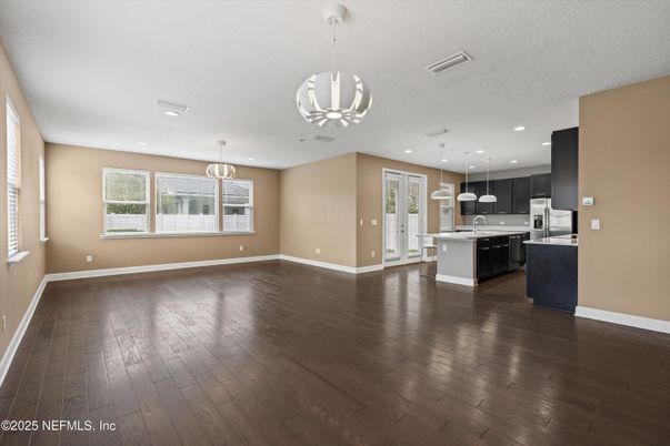 Empty room, Interior, Kitchen, Pendant Lights, Recessed Lighting, Stainless Steel Appliances, Wood Texture Flooring