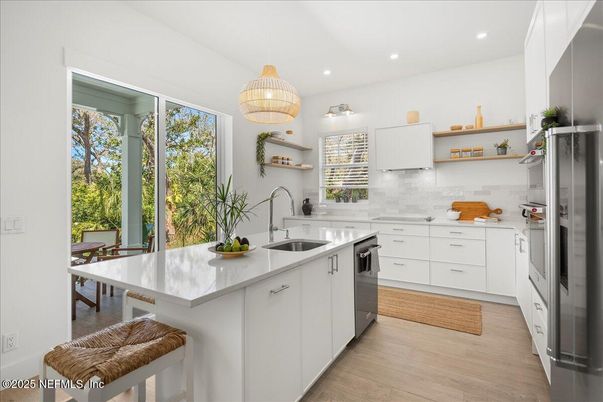 Interior, Kitchen, Pendant Lights, Recessed Lighting, Stainless Steel Appliances, Wood Texture Flooring