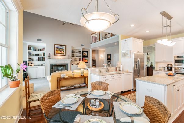 Dining room, Fireplace, Interior, Kitchen, Living room, Pendant Lights, Recessed Lighting, Stainless Steel Appliances, Wood Texture Flooring
