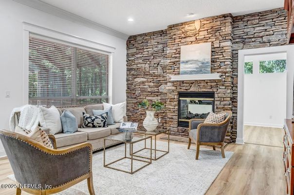Fireplace, Interior, Living room, Recessed Lighting, Stone Walls, Wood Texture Flooring