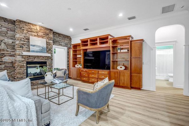 Fireplace, Interior, Living room, Recessed Lighting, Stone Walls, Wood Texture Flooring