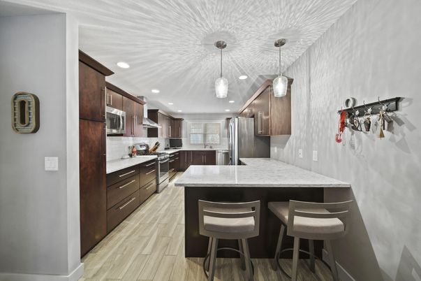 Interior, Kitchen, Pendant Lights, Recessed Lighting, Stainless Steel Appliances, Wood Texture Flooring