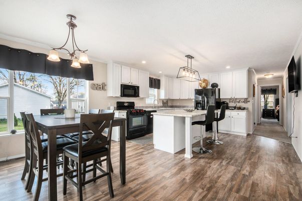 Chandelier, Dining room, Interior, Kitchen, Pendant Lights, Recessed Lighting, Stainless Steel Appliances, Wood Texture Flooring