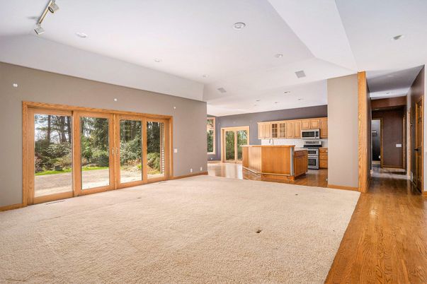 Empty room, Interior, Kitchen, Recessed Lighting, Stainless Steel Appliances, Wood Texture Flooring