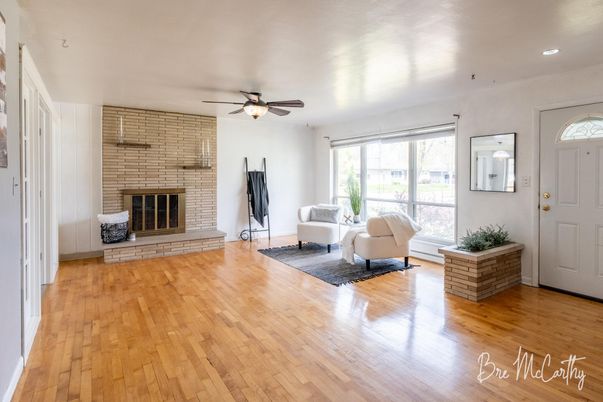 Fireplace, Interior, Living room, Recessed Lighting, Stone Walls, Wood Texture Flooring