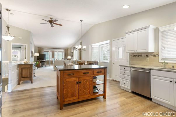 Chandelier, Dining room, Interior, Kitchen, Pendant Lights, Recessed Lighting, Stainless Steel Appliances, Wood Texture Flooring