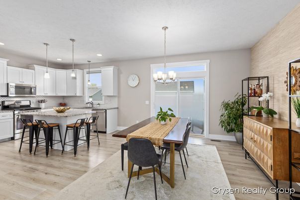 Chandelier, Dining room, Interior, Kitchen, Pendant Lights, Recessed Lighting, Stainless Steel Appliances, Wood Texture Flooring