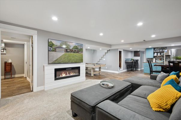 Dining room, Fireplace, Game Room, Interior, Living room, Recessed Lighting, Wood Texture Flooring