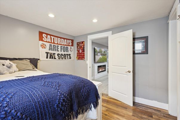 Bedroom, Fireplace, Interior, Recessed Lighting, Wood Texture Flooring