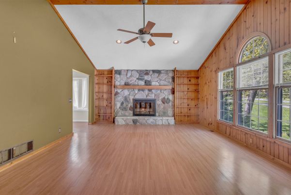 Empty room, Fireplace, Interior, Recessed Lighting, Stone Walls, Wood Texture Flooring, Wooden Walls