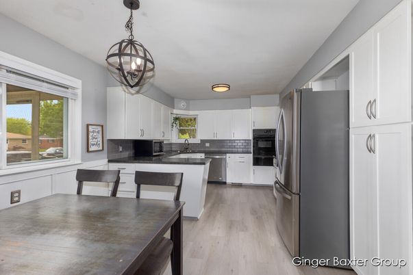 Chandelier, Dining room, Interior, Kitchen, Pendant Lights, Stainless Steel Appliances, Wood Texture Flooring
