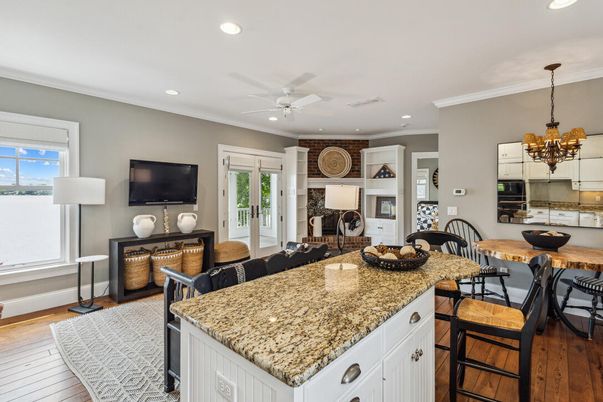 Chandelier, Dining room, Fireplace, Interior, Kitchen, Living room, Recessed Lighting, Wood Texture Flooring