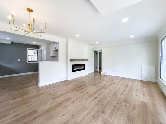 Chandelier, Empty room, Fireplace, Interior, Recessed Lighting, Wood Texture Flooring