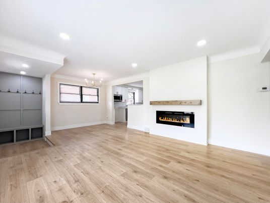 Chandelier, Empty room, Fireplace, Interior, Pendant Lights, Recessed Lighting, Wood Texture Flooring