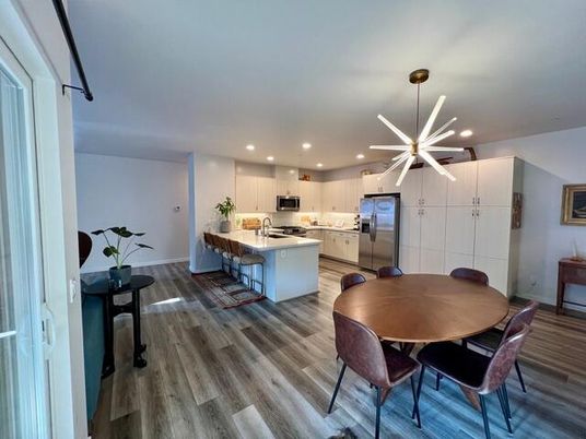 Dining room, Interior, Kitchen, Pendant Lights, Recessed Lighting, Stainless Steel Appliances, Wood Texture Flooring