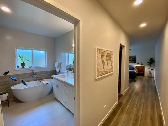 Bathroom, Dual Sink Vanities, Free Standing Baths, Interior, Recessed Lighting, Wood Texture Flooring