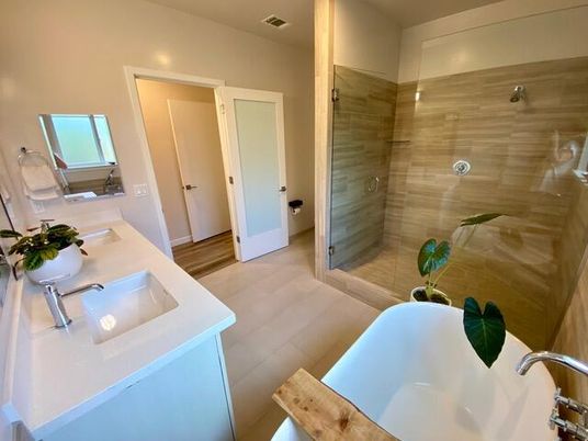 Bathroom, Dual Sink Vanities, Glass Shower, Interior, Recessed Lighting, Wood Texture Flooring