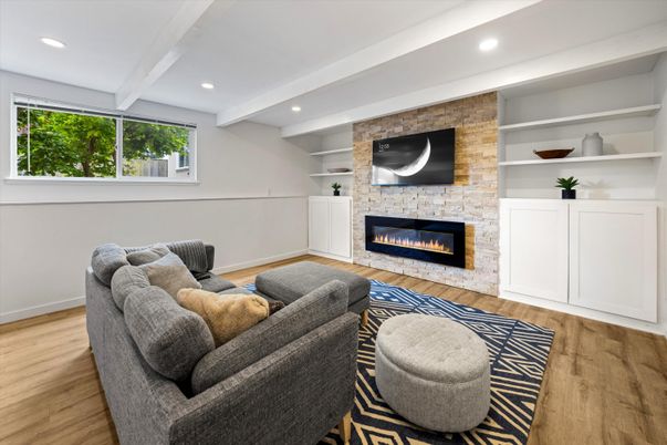 Fireplace, Interior, Living room, Recessed Lighting, Stone Walls, Wood Texture Flooring