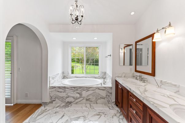 Bathroom, Dual Sink Vanities, Interior, Marble, Recessed Lighting, Wood Texture Flooring